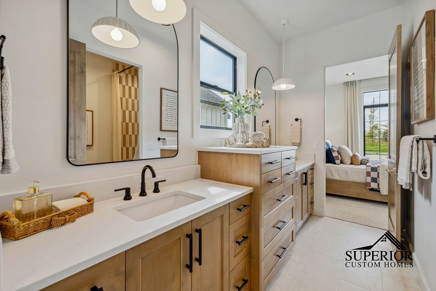 A bathroom with two sinks and two mirrors.