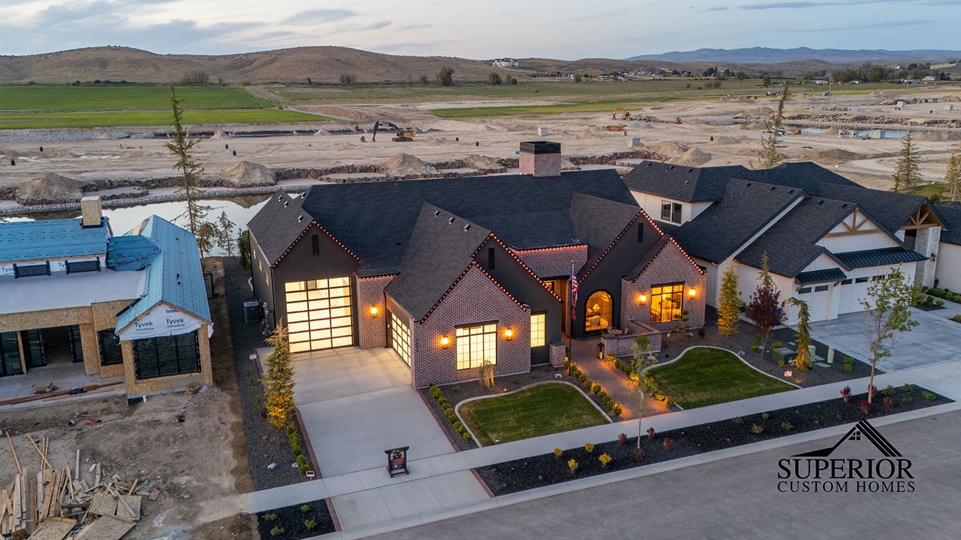 An aerial view of a large house with a lot of windows.