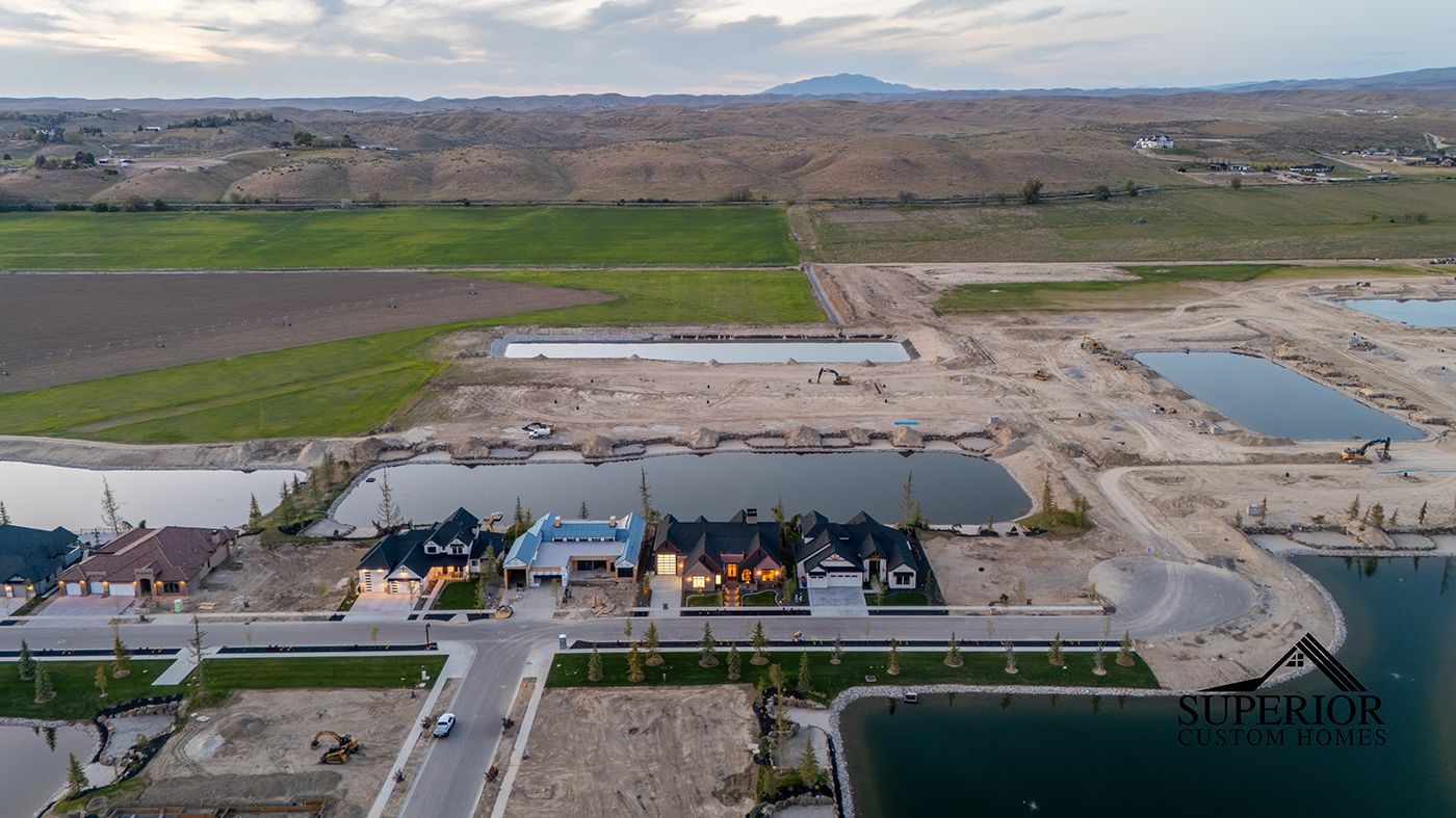 An aerial view of a residential area with lots of water and houses.