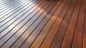 A close up of a wooden deck with a diagonal pattern