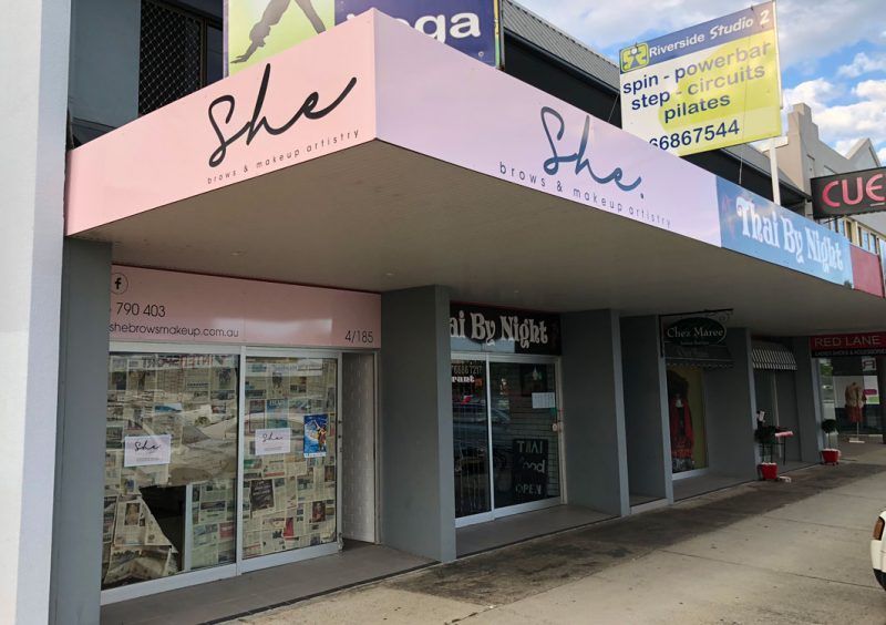 A Store Front With a Pink Awning That Says She on It — Sign Media Solutions in Ballina, NSW