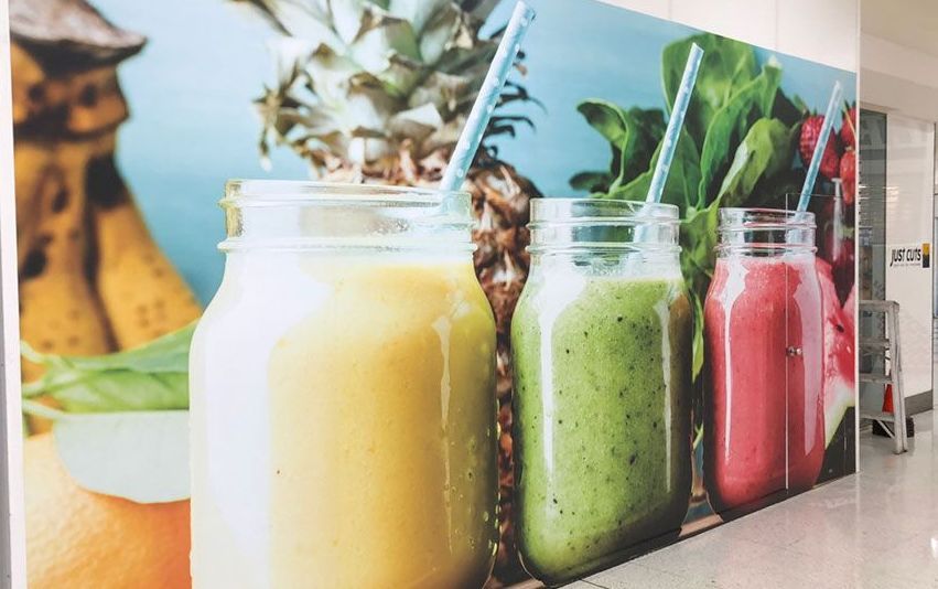 A Row of Smoothies in Mason Jars With Straws on a Table — Sign Media Solutions in Ballina, NSW