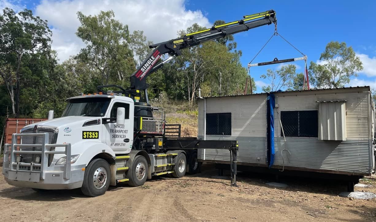 A Truck With A Crane Attached To It Is Carrying A Trailer — Single Transport Services In Palmyra, QLD