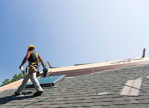 Man Repairing the Roof  — Denver, CO — J&P Roofing Inc.