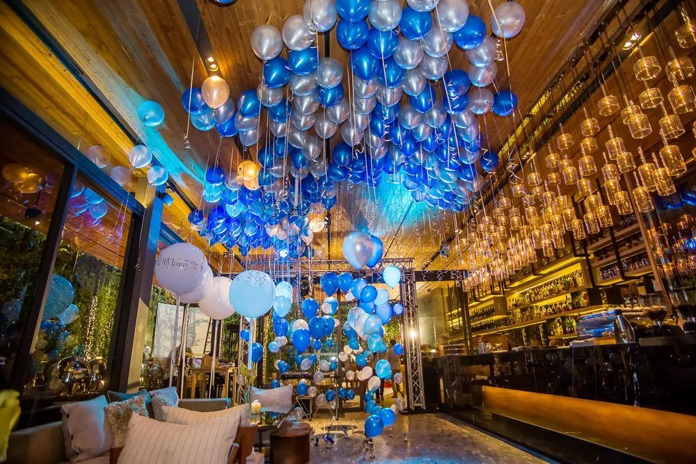 A Room Filled With Blue and White Balloons Hanging From the Ceiling — Bowen Hire & Sales in Bowen, QLD