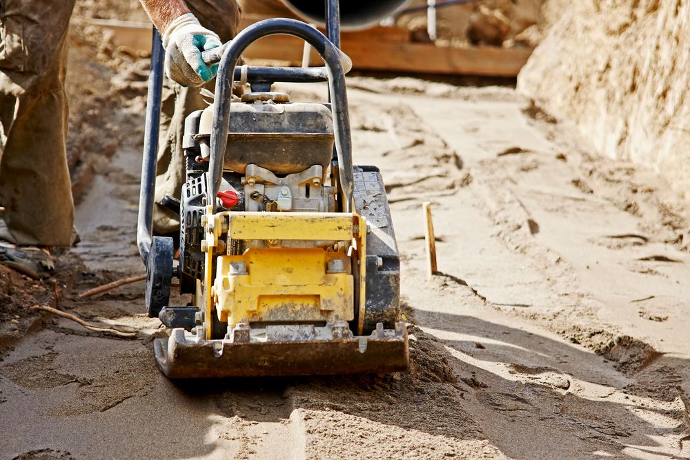 Worker Use Vibratory Plate Compactor — Bowen Hire & Sales in Collinsville, QLD