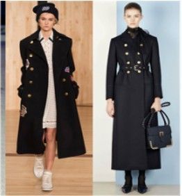 A woman is wearing a black coat and a white dress.