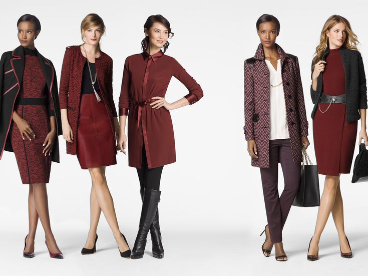 A group of women standing next to each other wearing red clothes