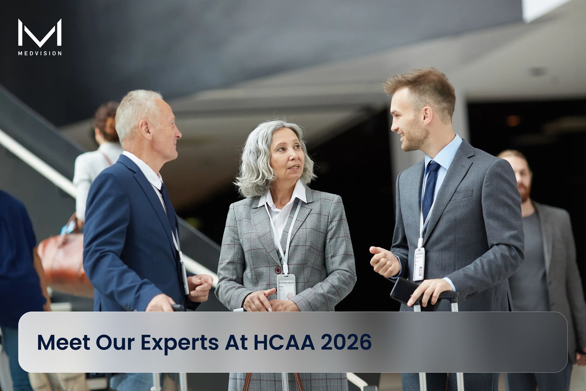 Three professionals conversing at a conference; text: 