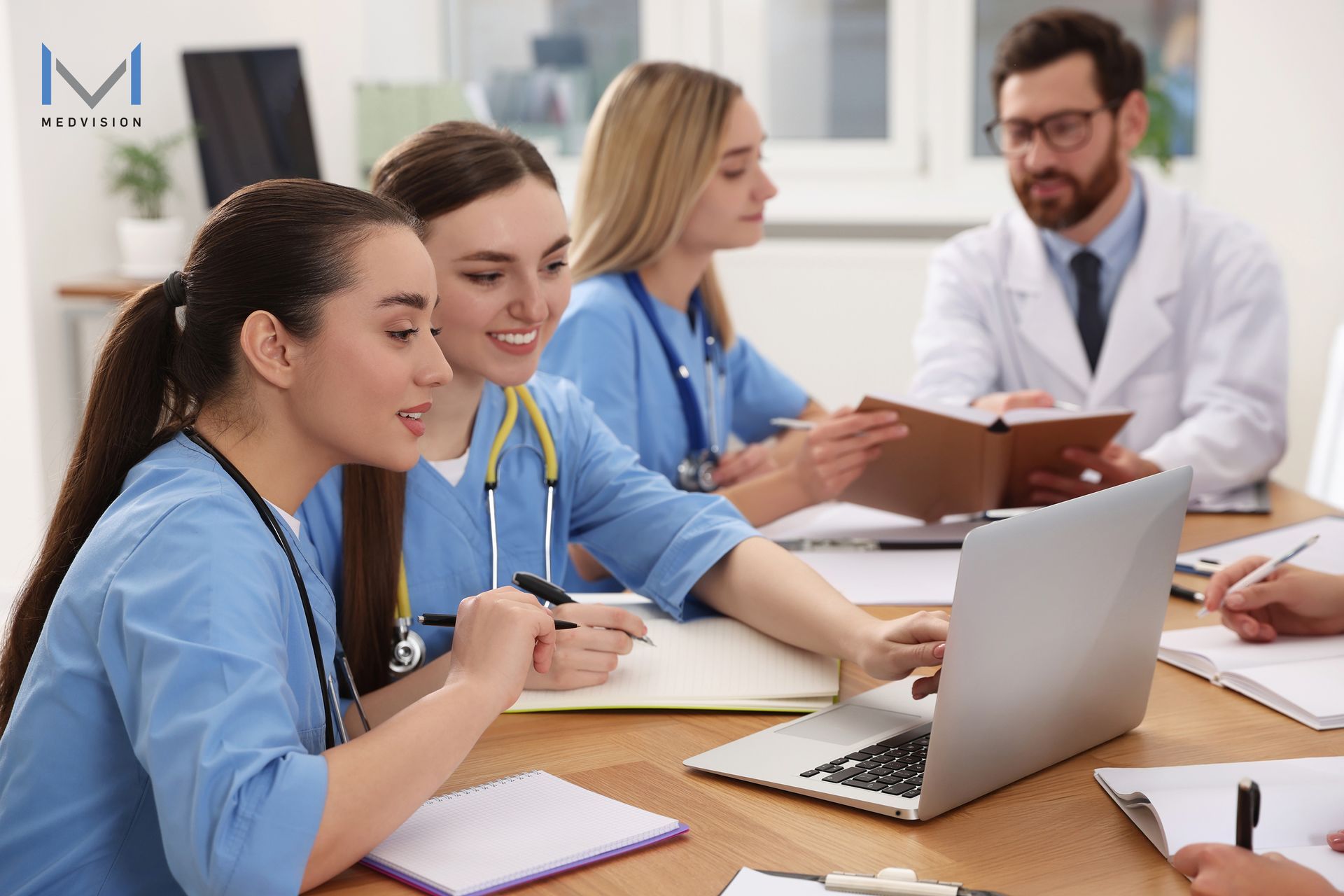 Healthcare providers sitting together, accessing QuickCap for ACO REACH success.