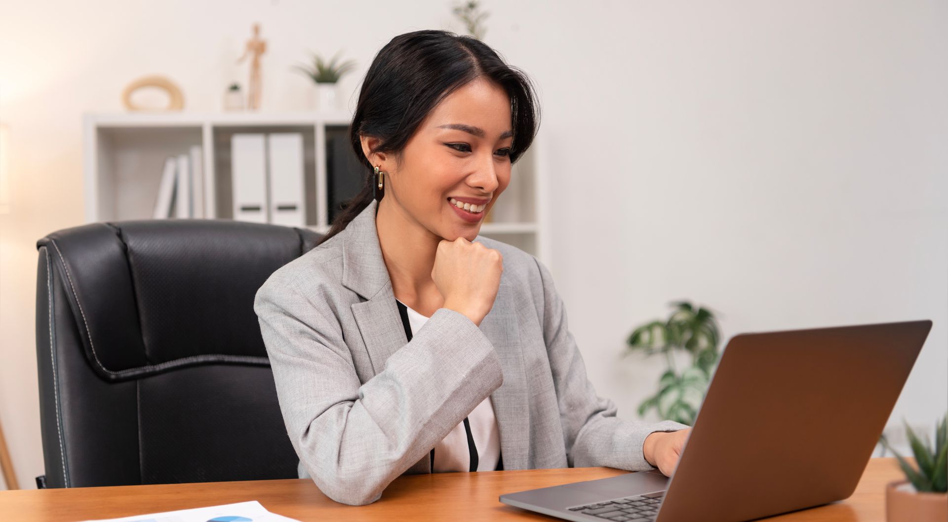 A woman managing automated claims adjudication systems as part of TPA operations. 