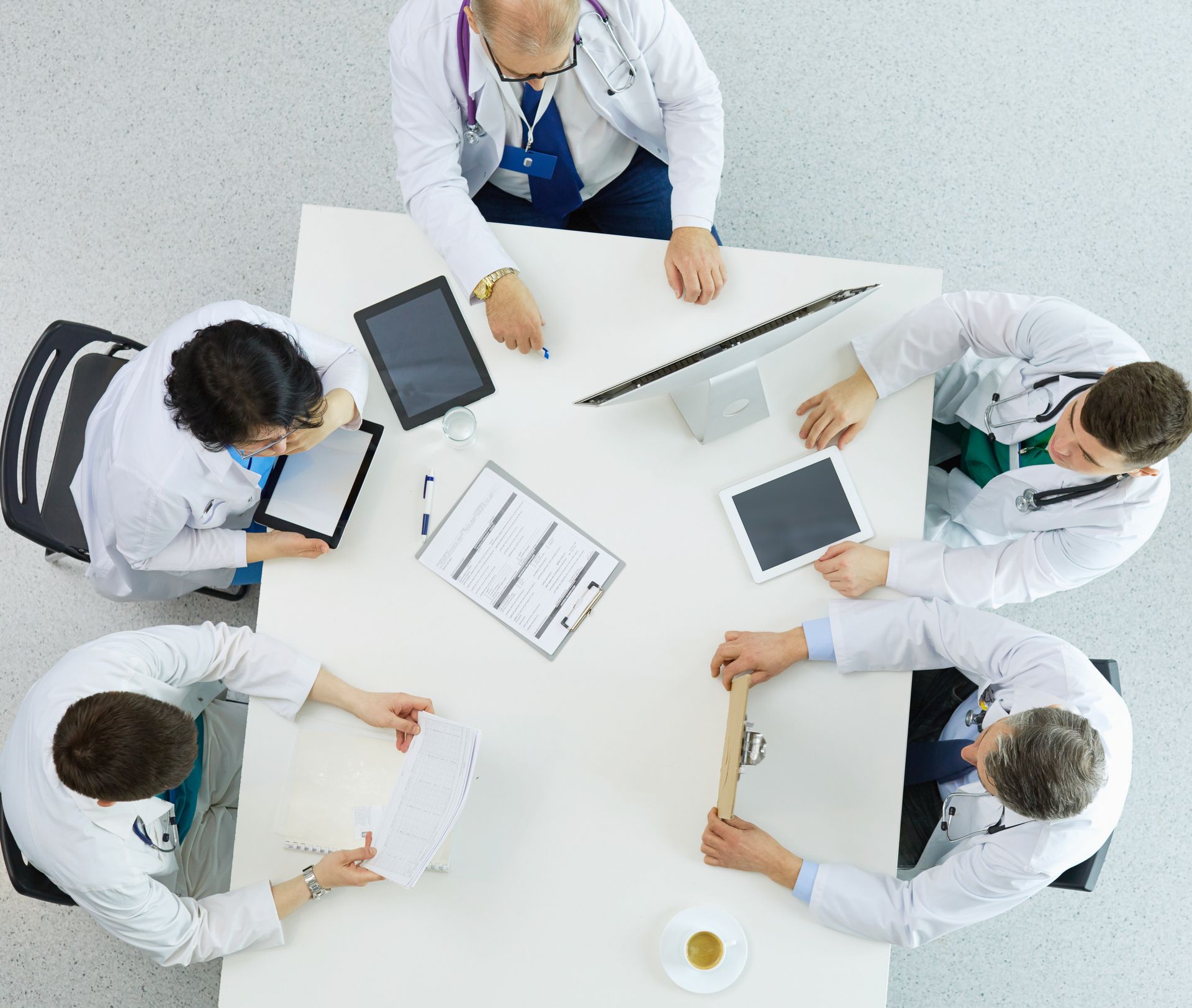 a group of doctors strategizing patient attribution strategies