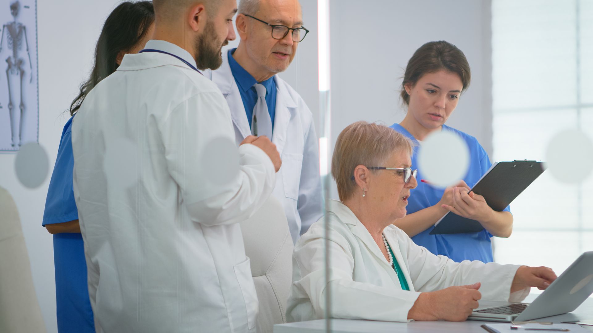 A team of medical professionals discussing strategies based on the collated data.