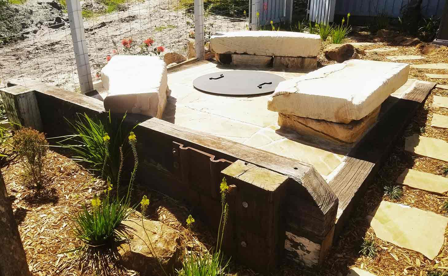 There is a Fire Pit in the Middle of the Garden — Full Circle Landscaping in Tweed Heads, NSW