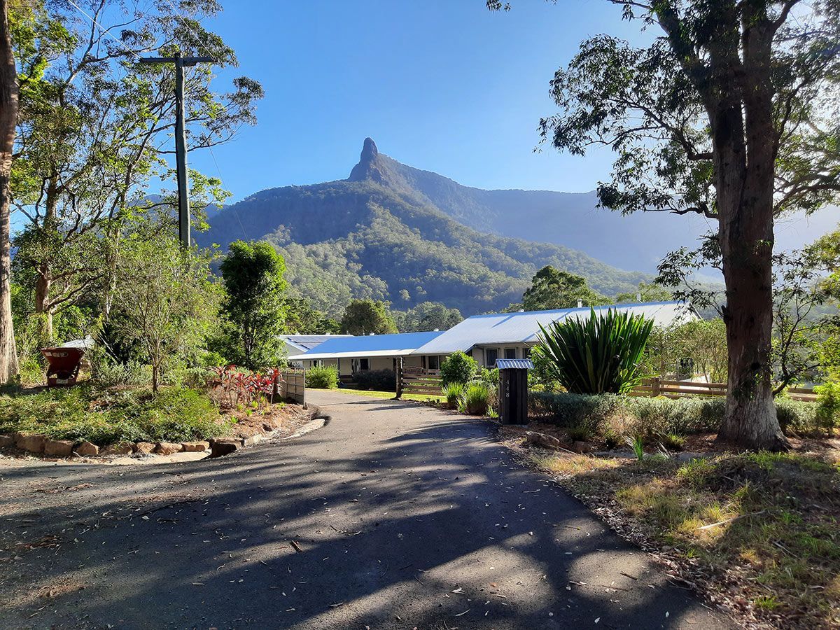 A Road Leading to a House With a Mountain in the Background — Full Circle Landscaping in Currumbin Valley, QLD