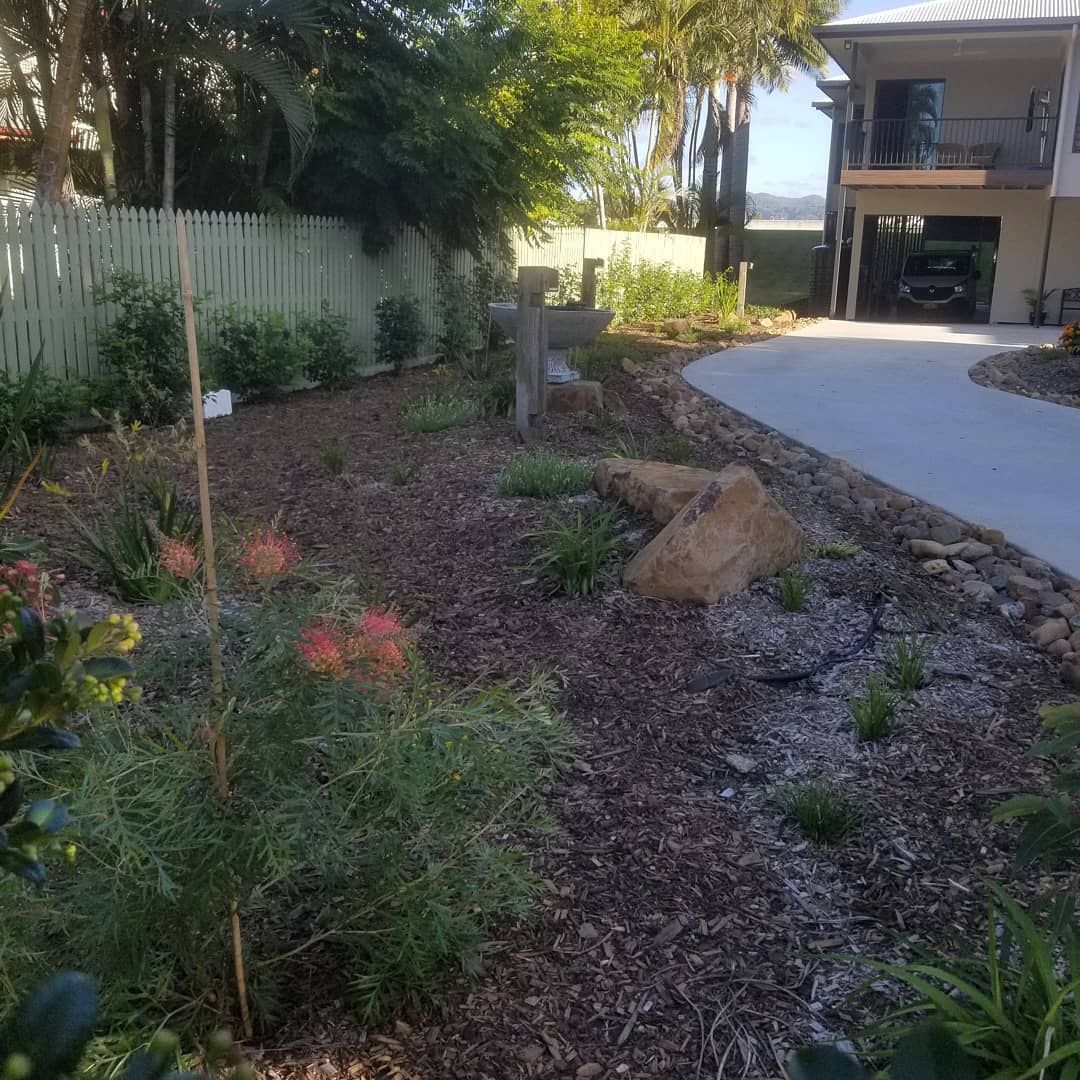 A House With A Driveway And A Lot Of Plants In Front Of It — Full Circle Landscaping in Uki, NSW