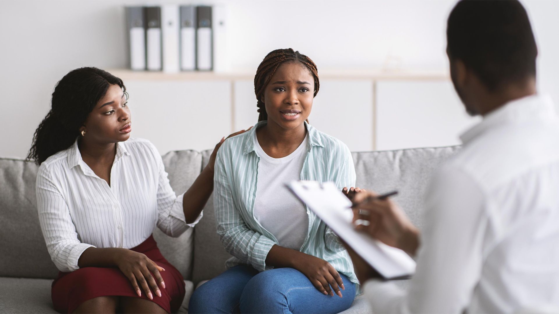 Bathroom with white sinks on a wooden countertop