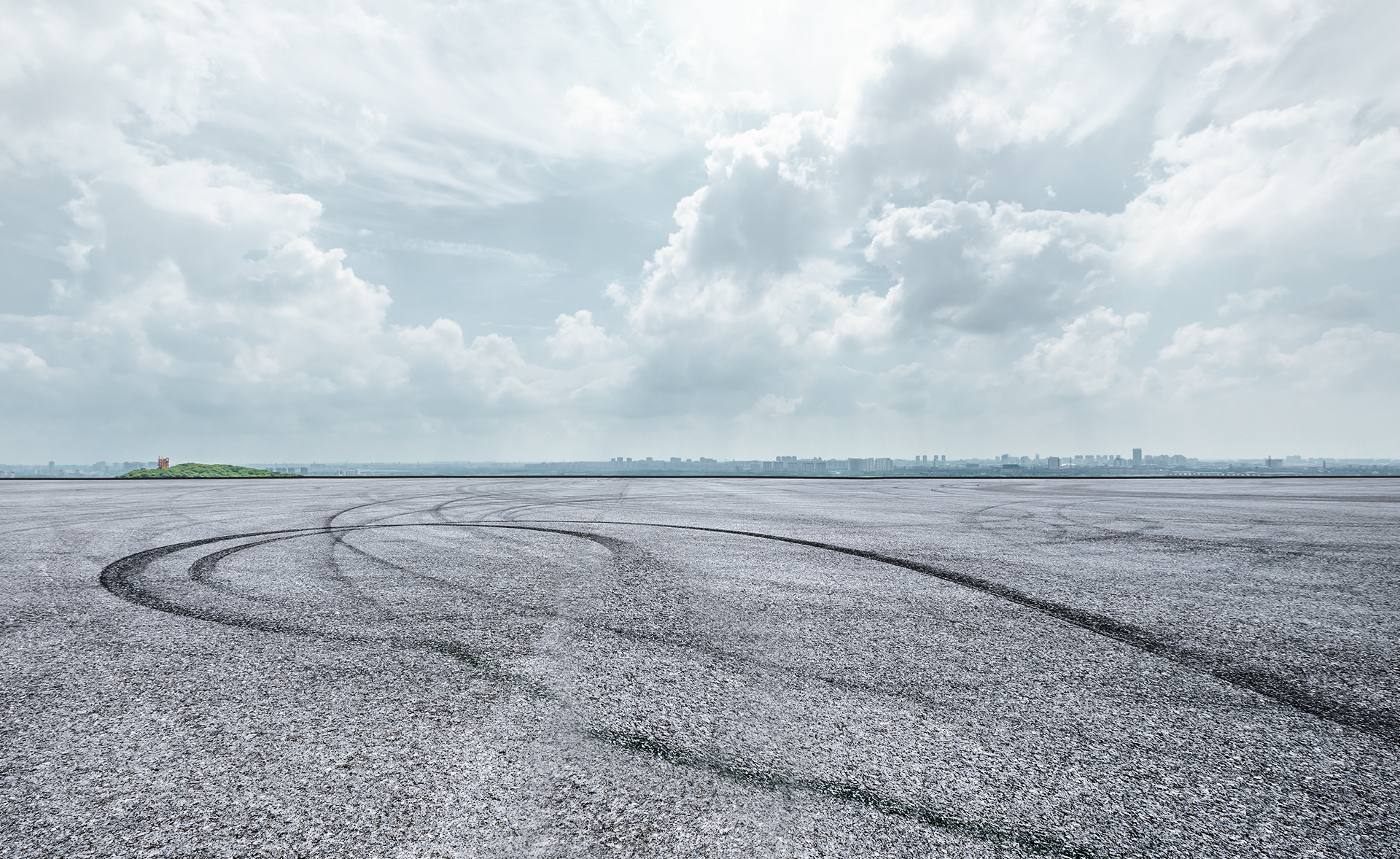 Field of white with tire tracks under a cloudy sky. | Fincastle Automotive