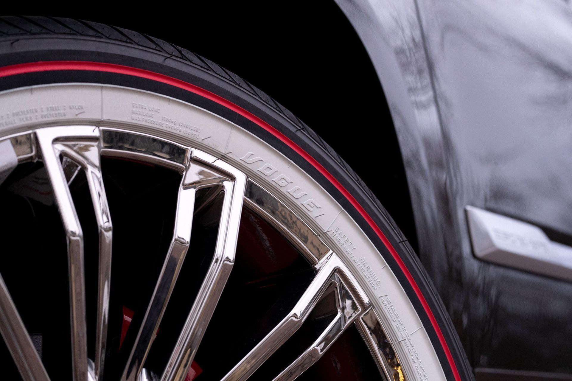 a close up of a car wheel with a red rim