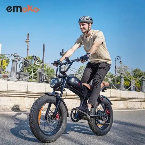 A C93 electric motorcycle is parked on the side of the road.