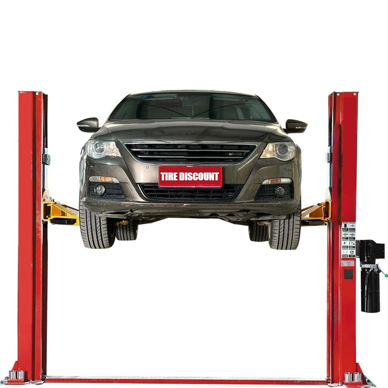Car lifted by a red two-post lift at a tire shop.