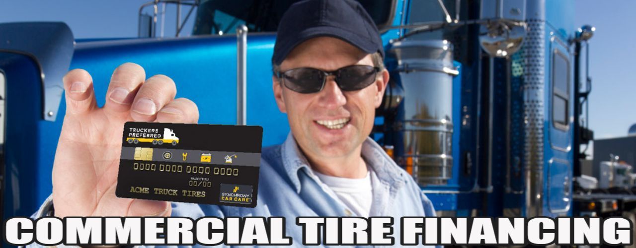PICTURE OF MAN HOLDING A DISCOUNT TIRES COMMERCIAL TIRE CREDIT CARD