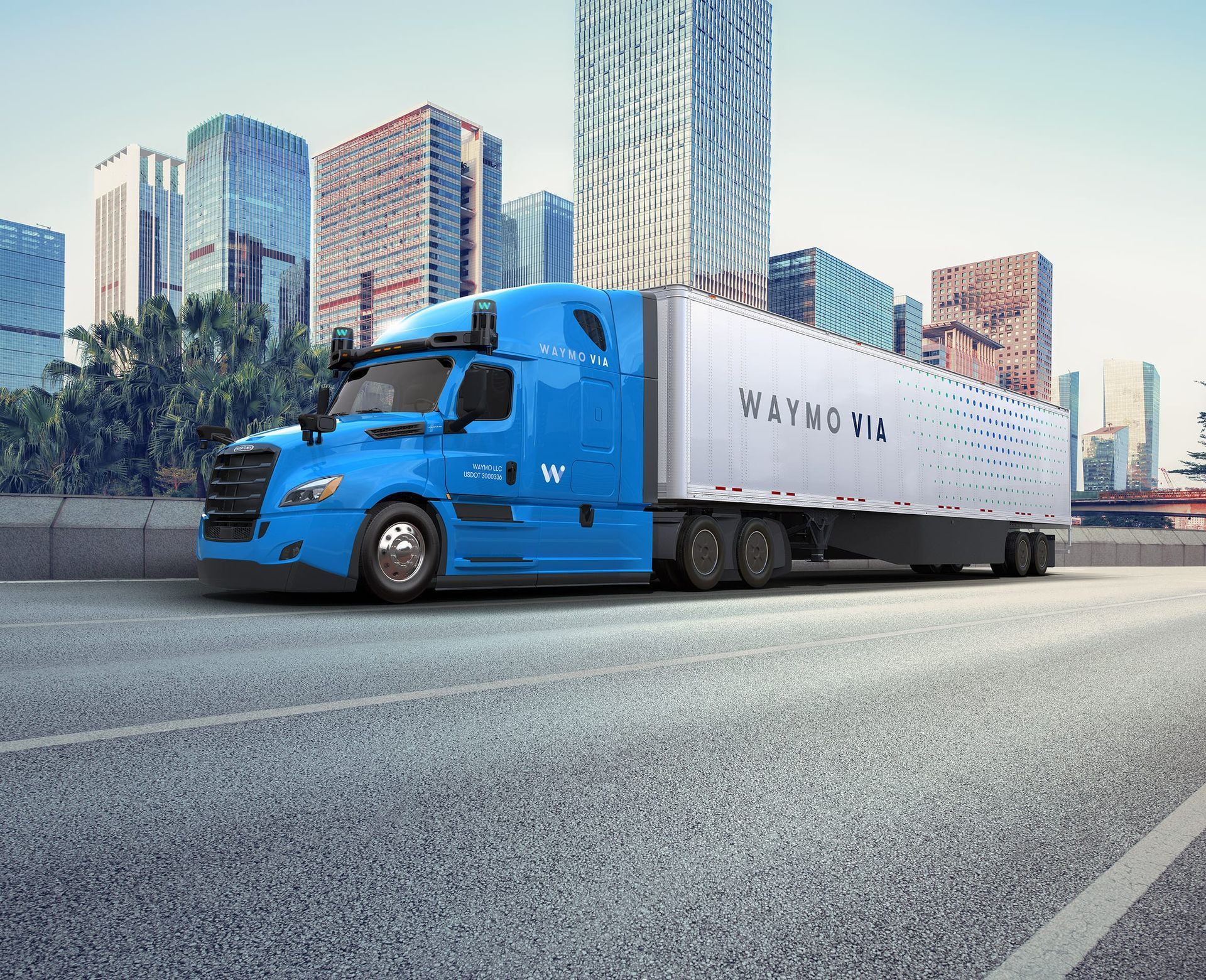 A blue semi truck is driving down a highway in front of DALLAS TX.