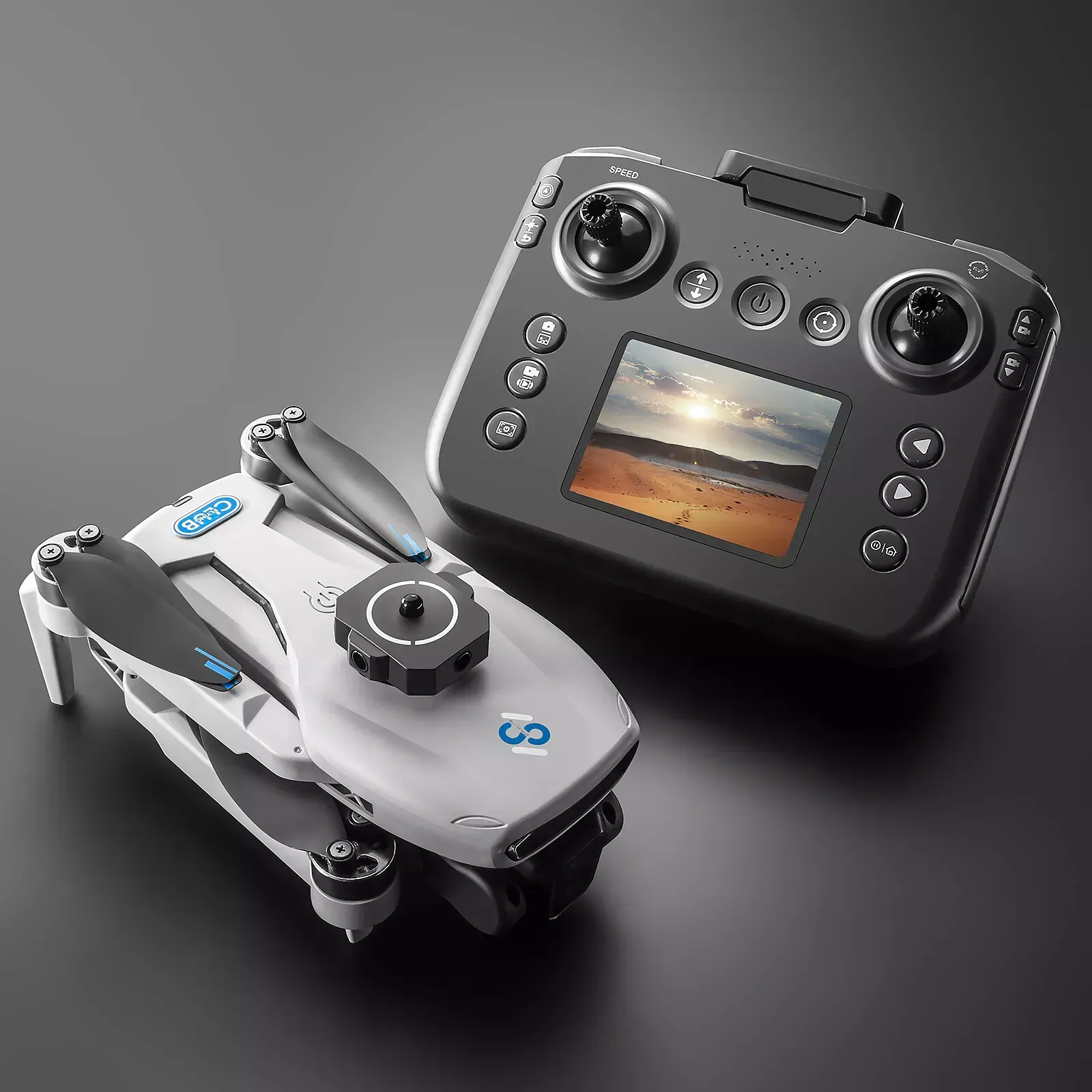 A remote control is sitting next to a S181 drone on a table.