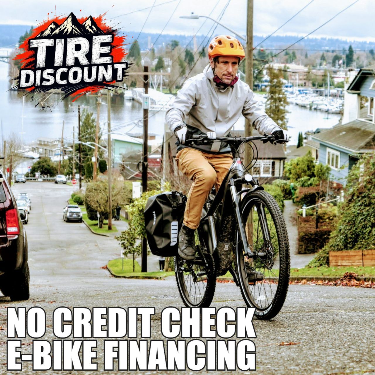 A man is riding an e-bike down a hill ..Seattle, WA