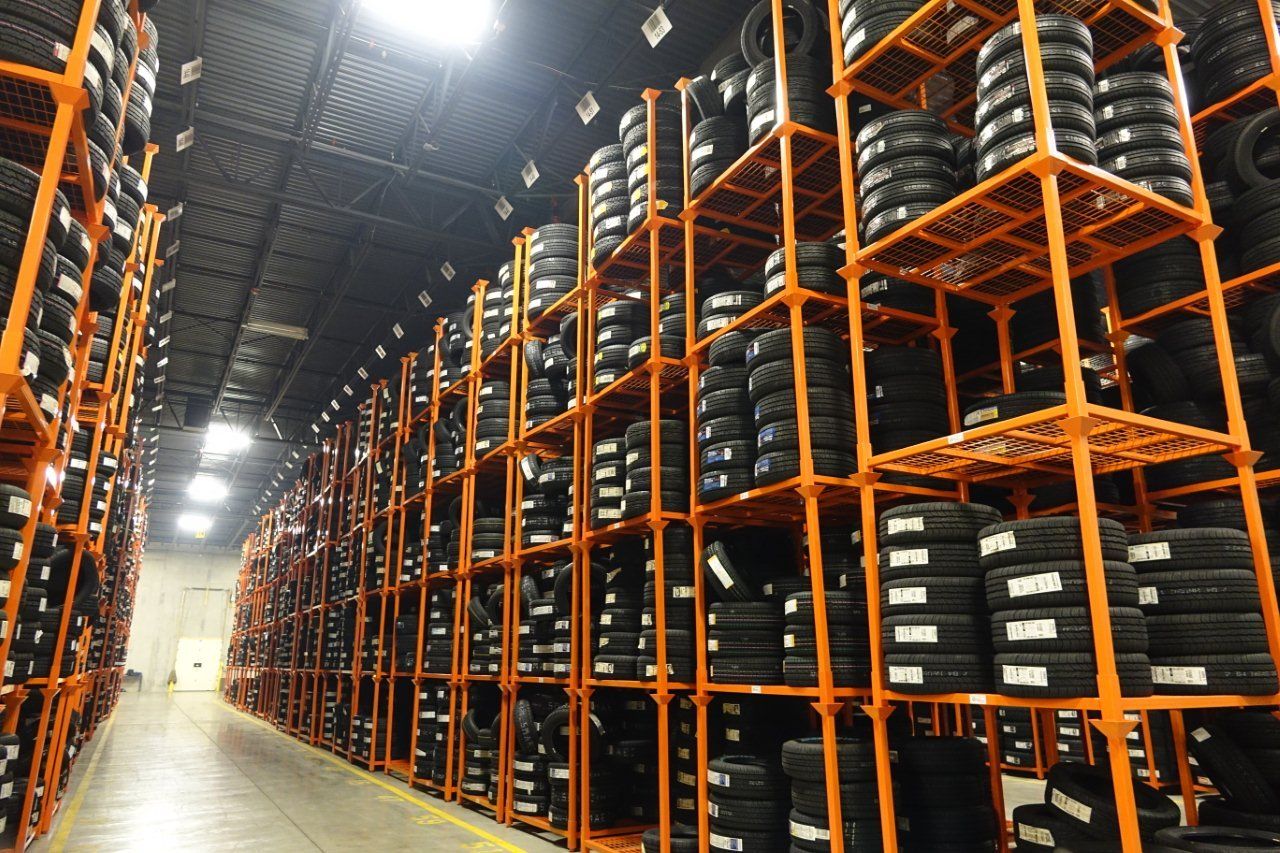 a large warehouse filled with lots of tires on shelves