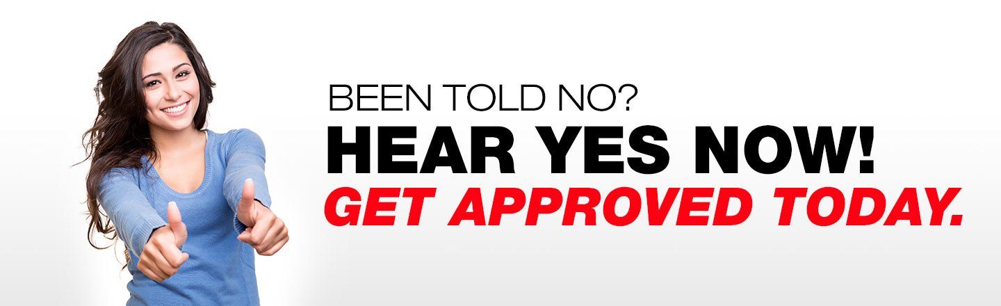 a woman is giving a thumbs up in front of a banner that says been told no hear yes now get approved today
