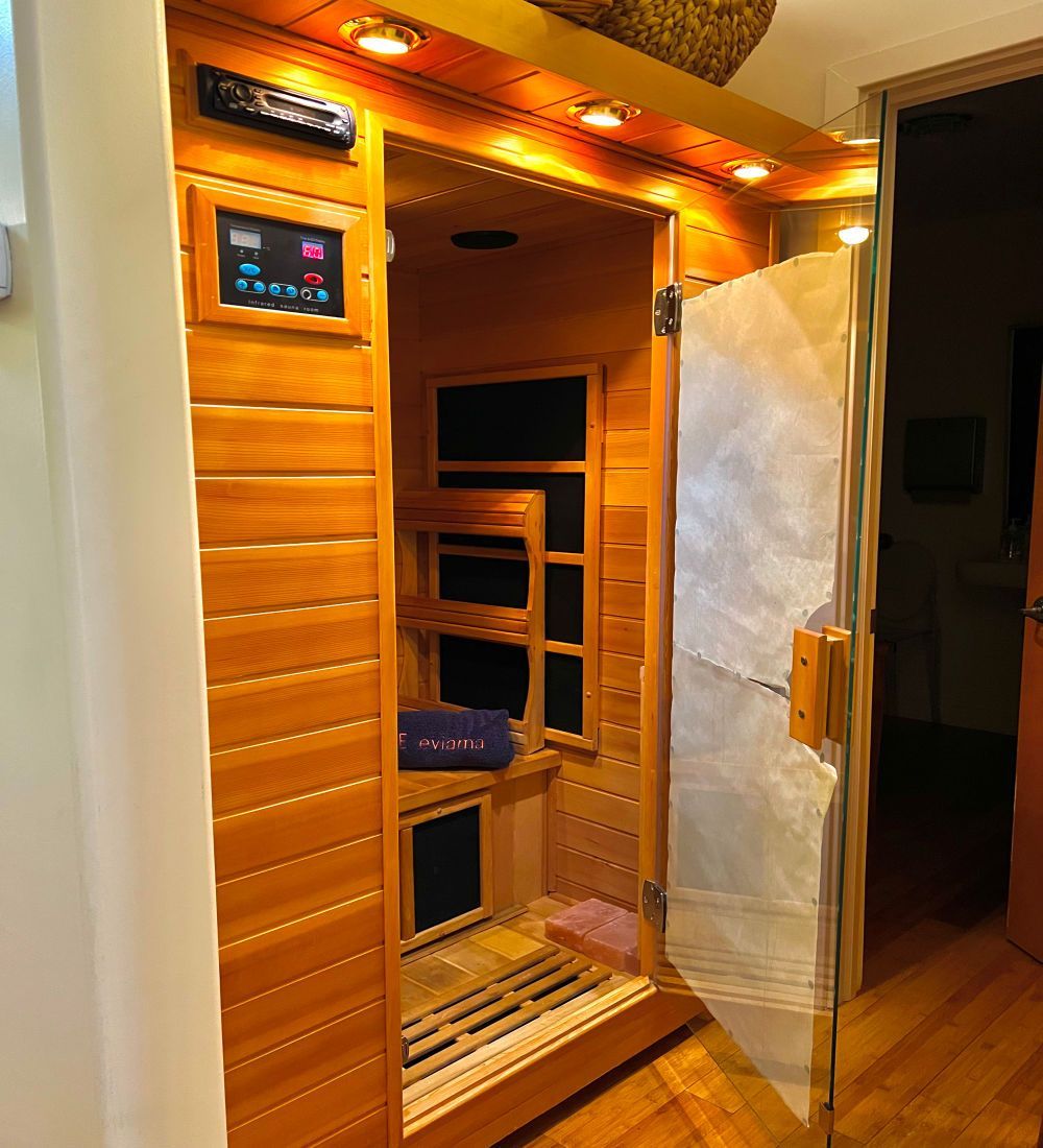 there is a massage table in a room with a brick wall .