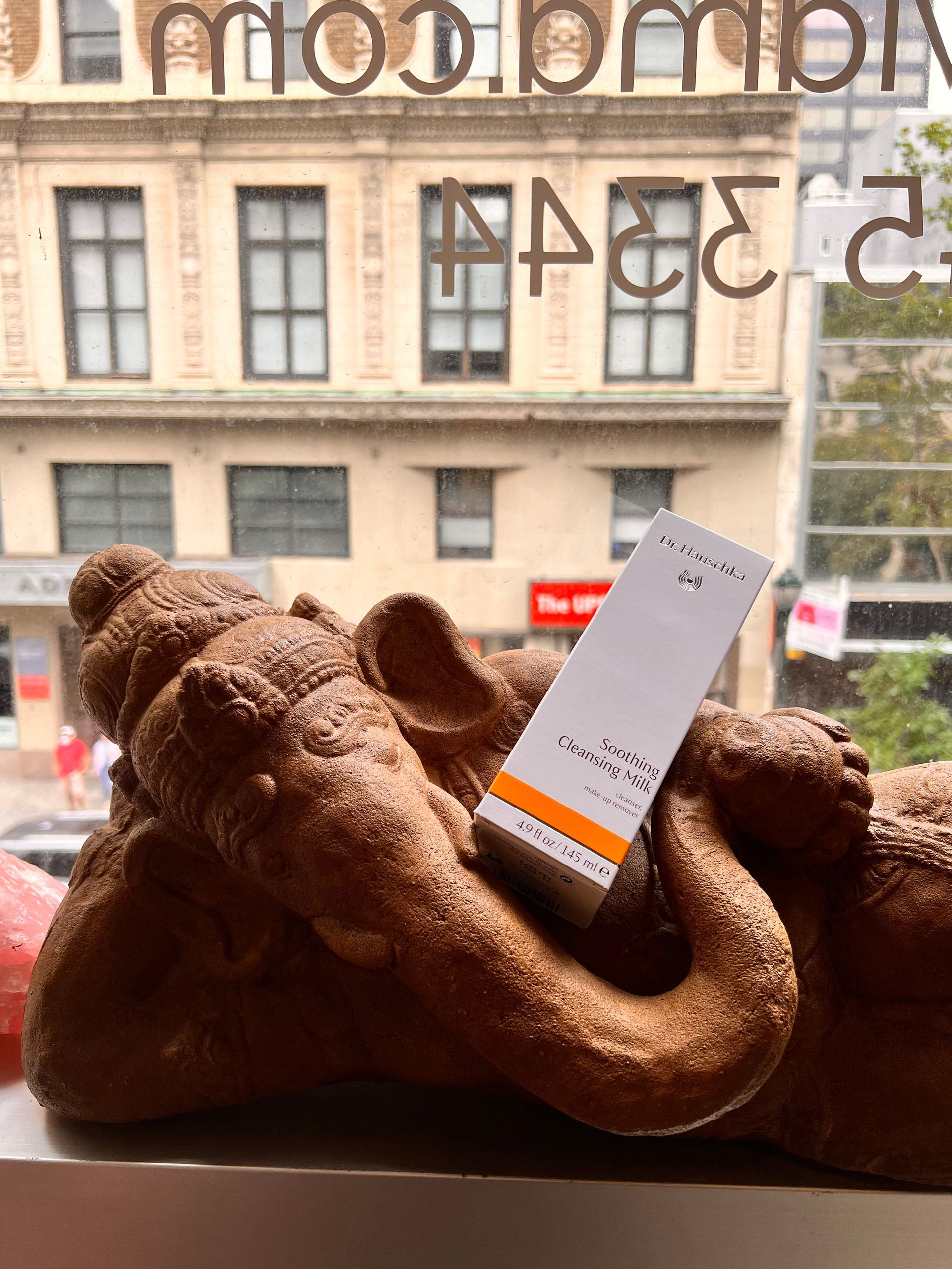 a bedroom with a bed and a chair in it