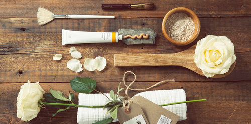a living room with a couch , chairs , and a bookshelf .