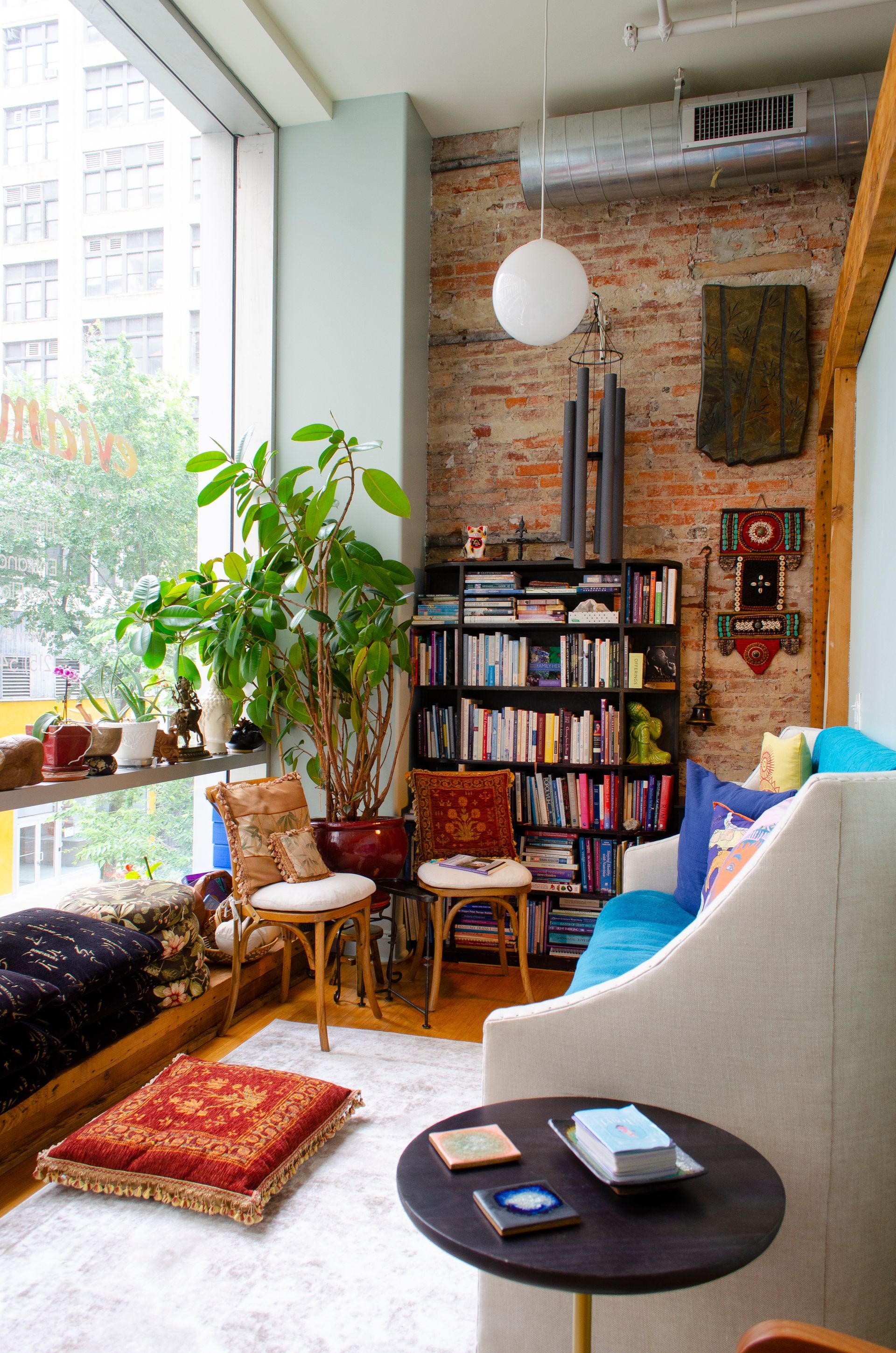 a living room filled with furniture and a bookshelf