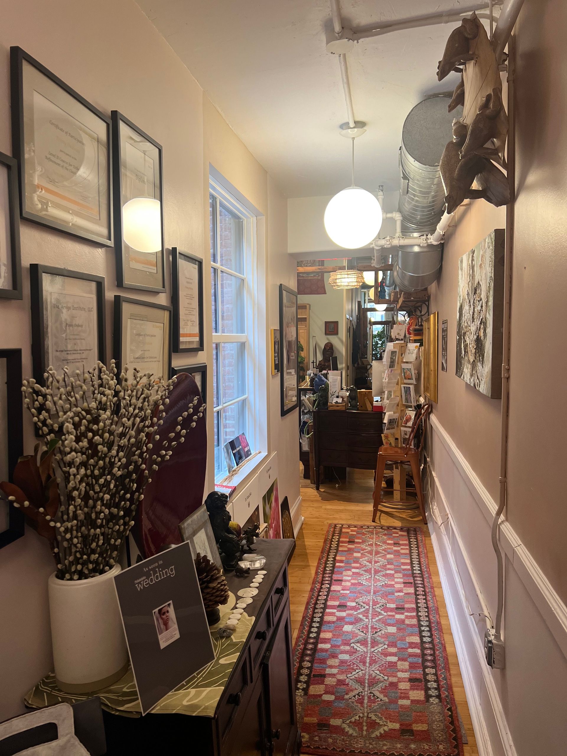 a rainbow rug is on the porch of a building .