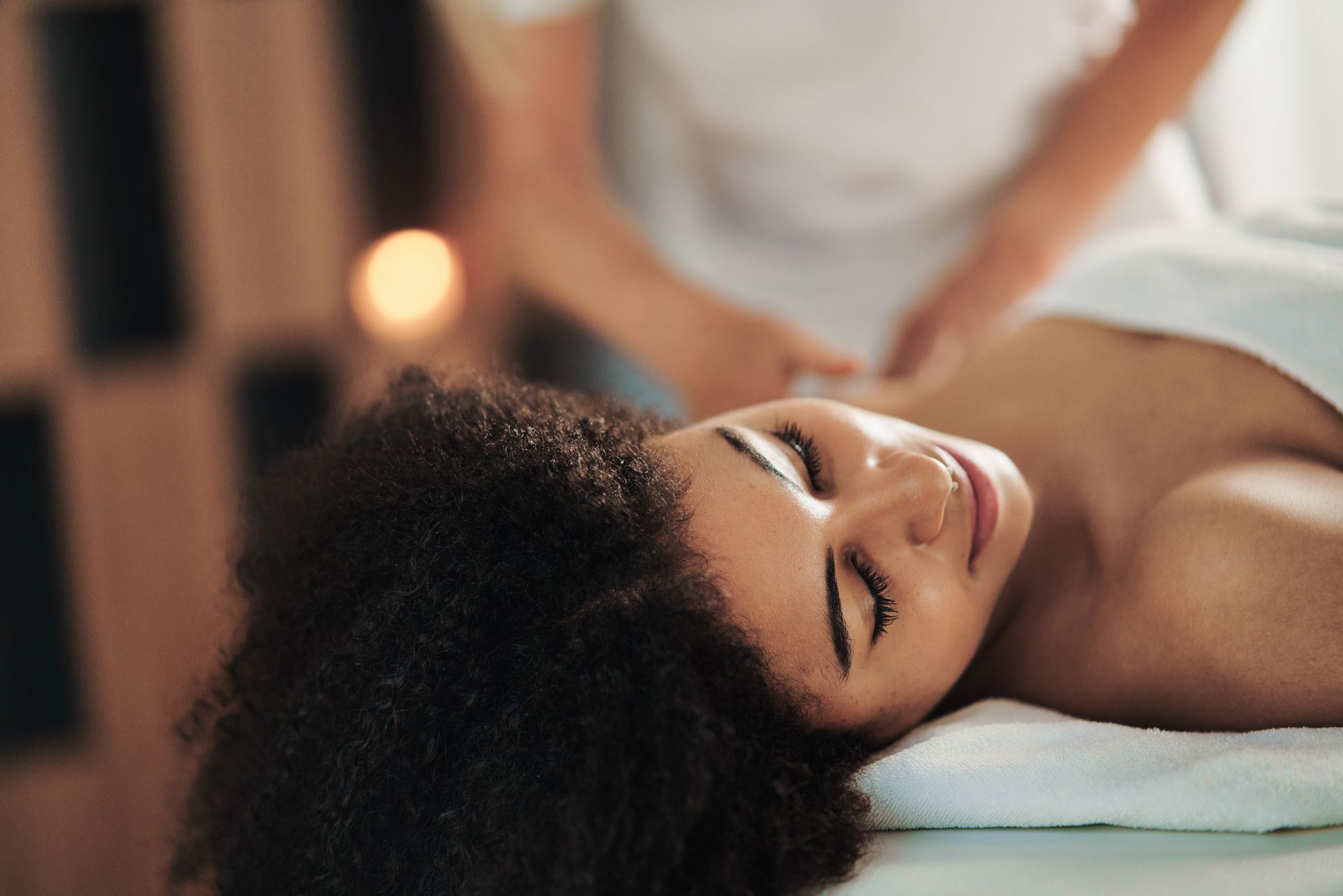a woman getting a back massage.