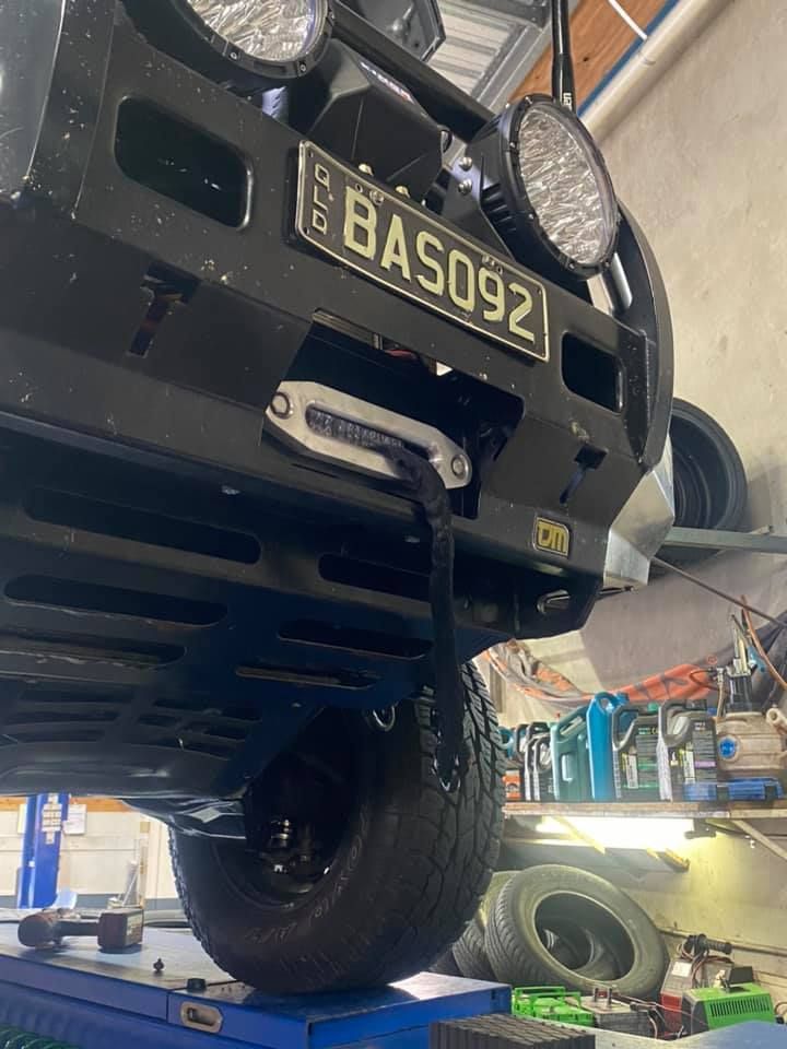 A Car With A License Plate That Says Bas092 Is Parked In A Garage — Marcoola Tyre & Mechanical In Marcoola, QLD