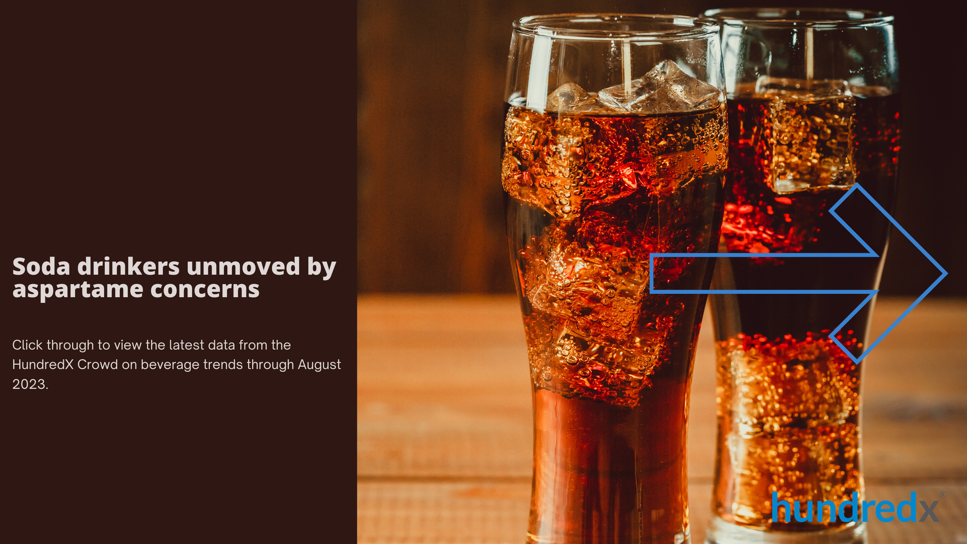 Two glasses of soda with ice on a wooden table.