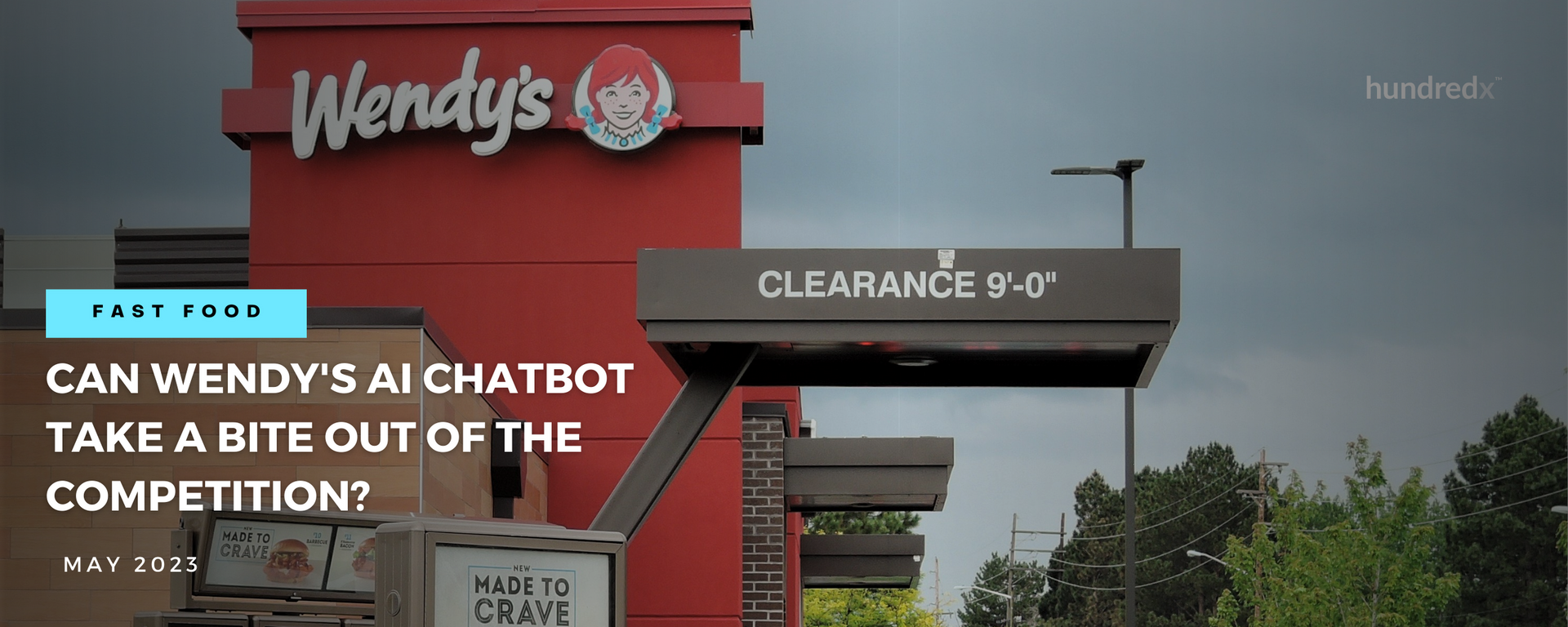 A wendy 's restaurant with a sign that says can wendy 's ai chatbot take a bite out of the competition