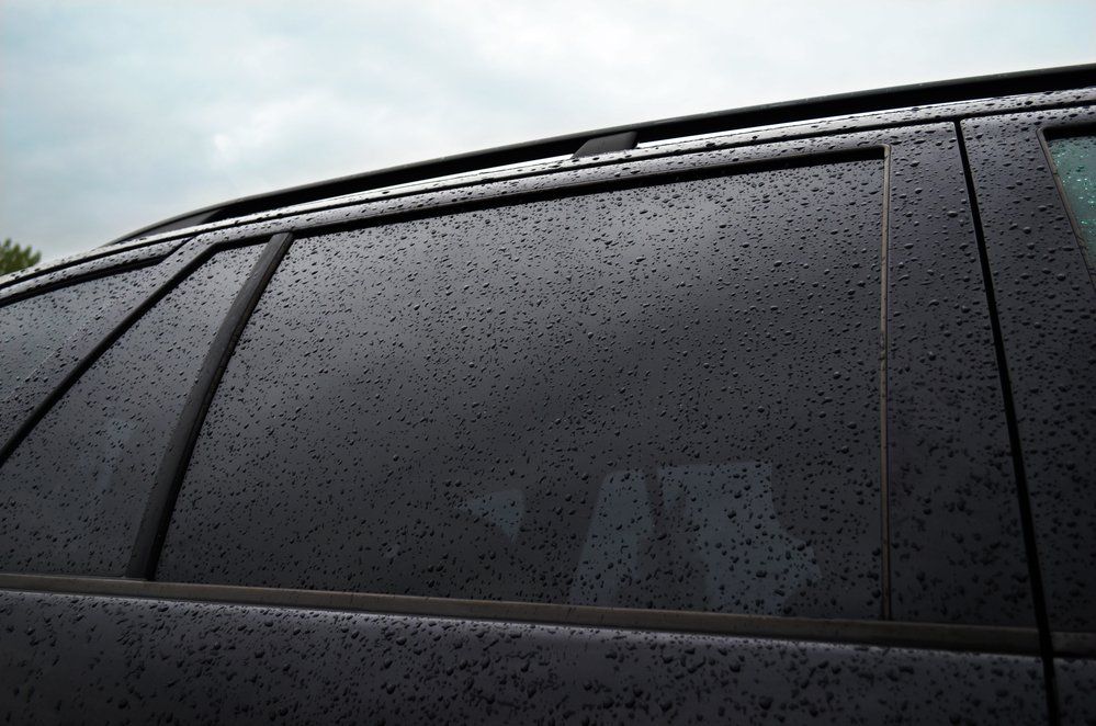 a car windshield with droplets