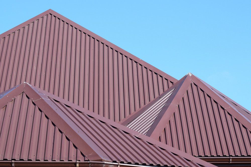 Modern Types Of Roofing Materials With Red Paint — Enduro Shield Roofing Solutions in Elanora, QLD
