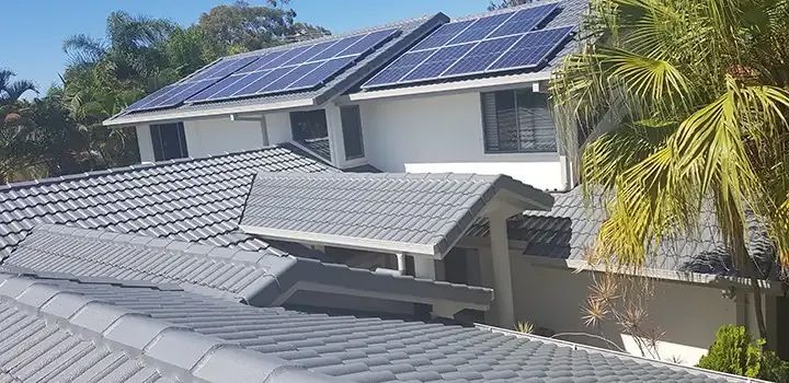 A House With A Lot Of Solar Panels On The Roof — Enduro Shield Roofing Solutions in Elanora, QLD