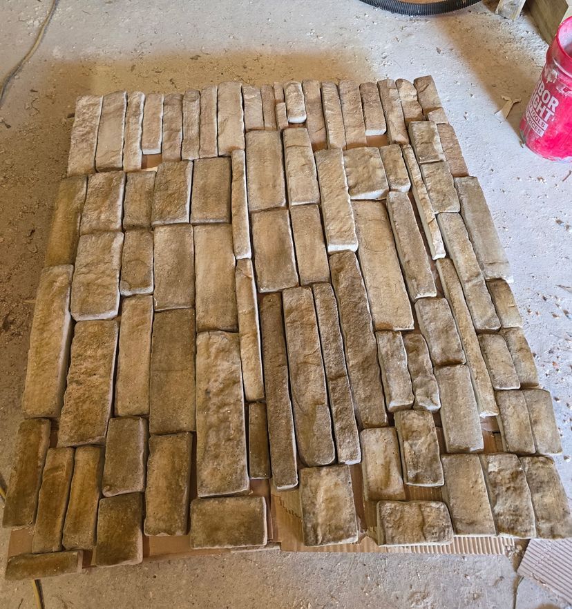 A pile of bricks on a concrete surface