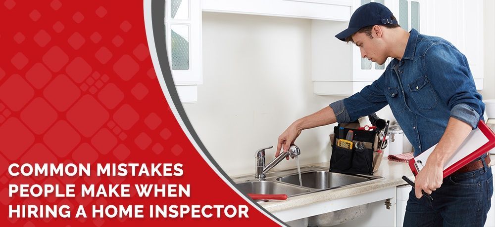 A man is fixing a sink in a kitchen.