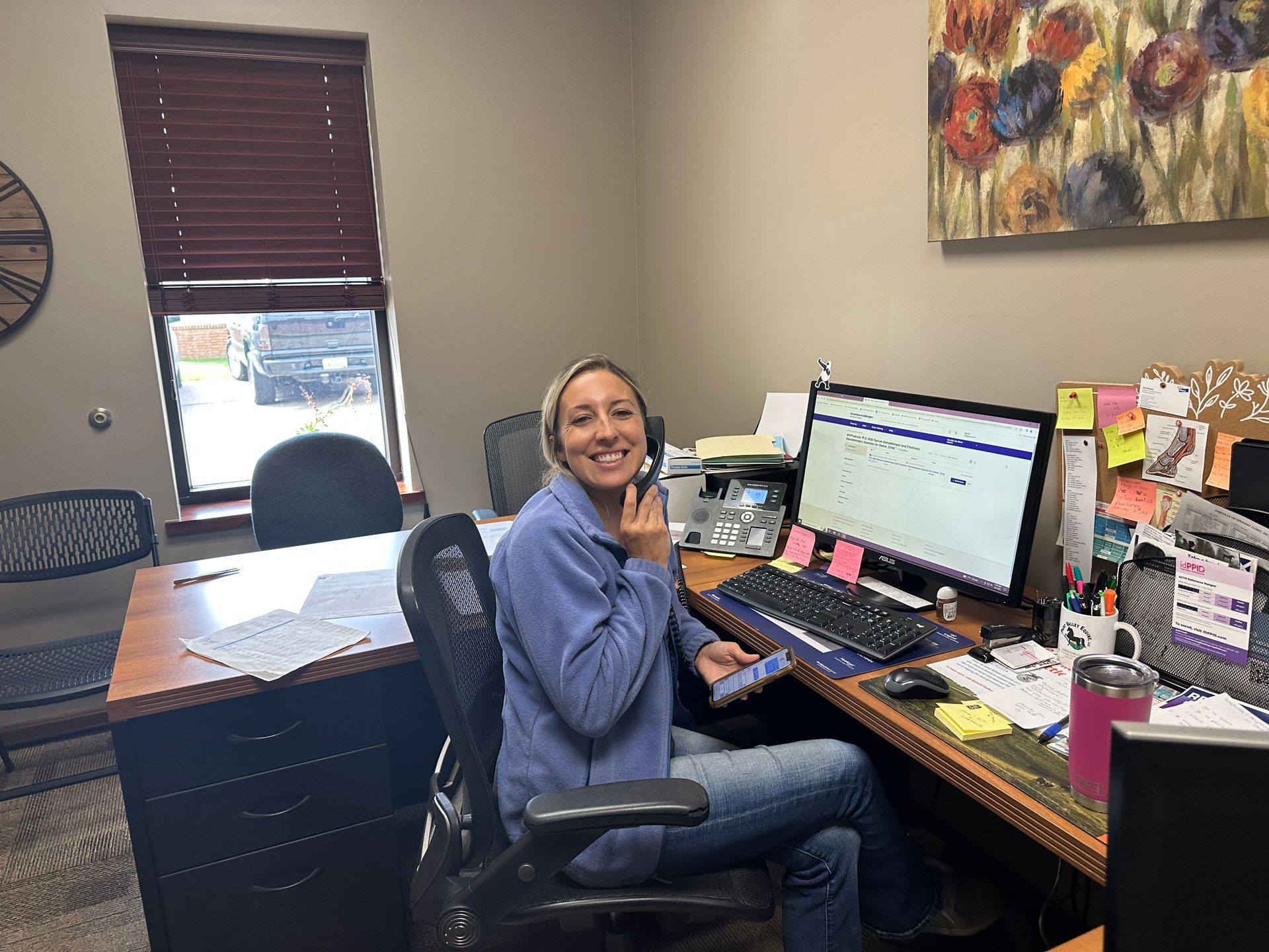 Maria answering the office phone