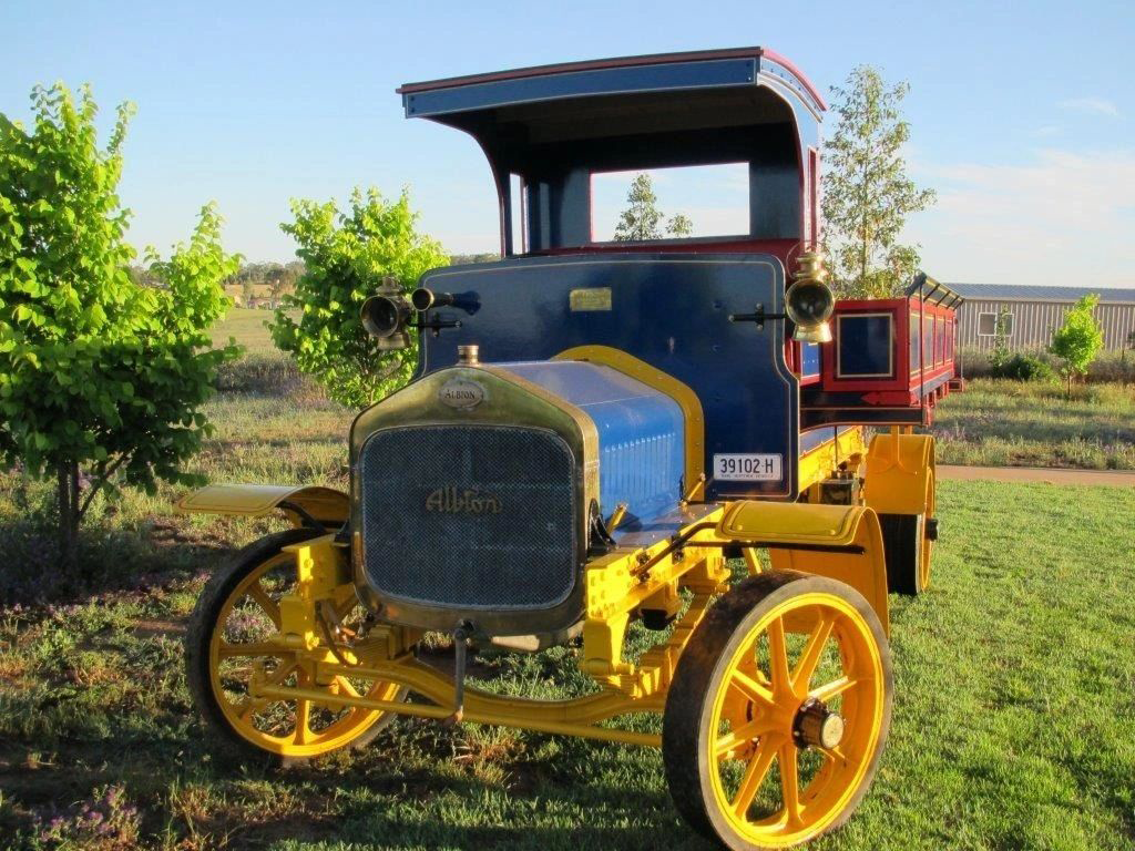 A blue and yellow vehicle with a license plate that says dn