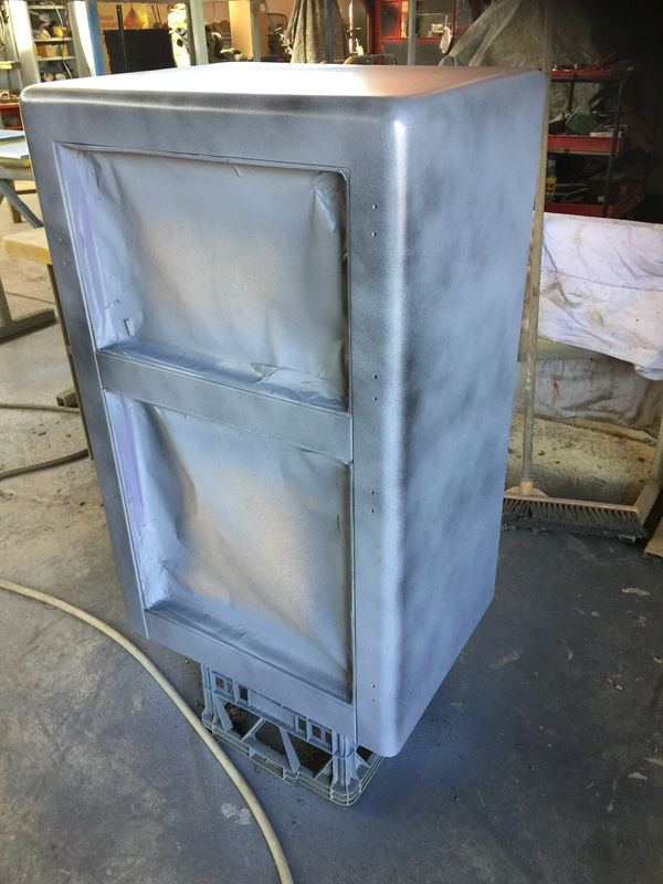 A gray box is sitting on a table in a room.