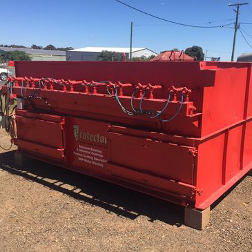 A red container with the word protector on it