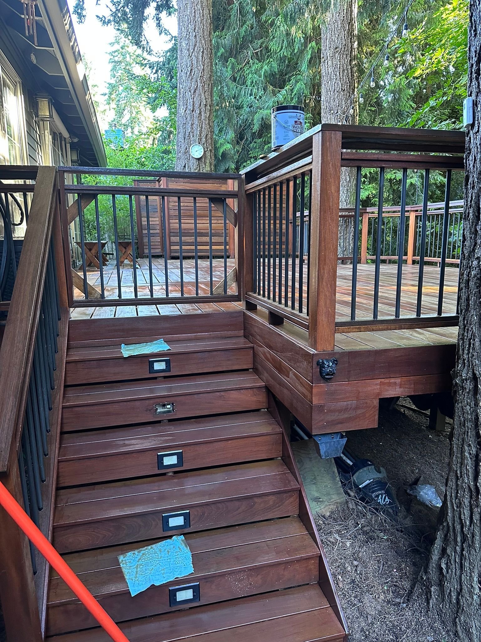 A wooden deck with stairs leading up to it